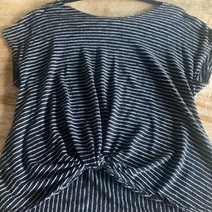 Women’s black and white cap sleeve shirt with cute knot at the bottom of shirt.